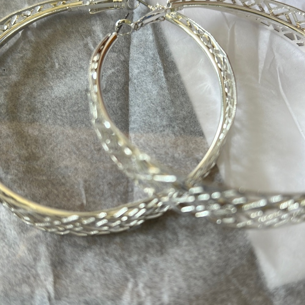 Oversized silver hoops chris cross design